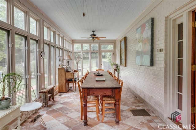 sunroom with wood ceiling and ceiling fan