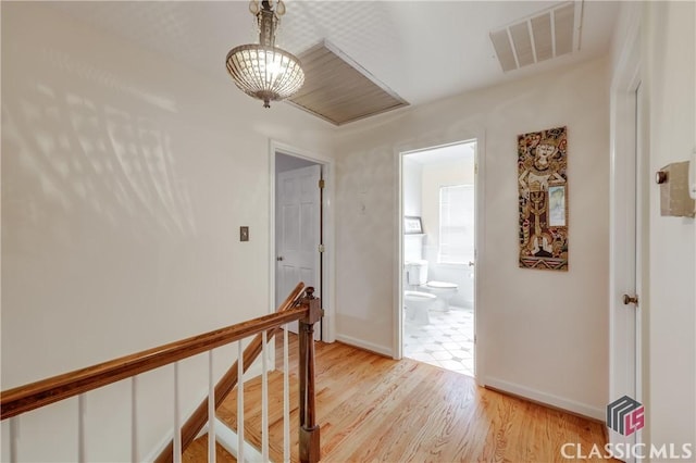 hall with light hardwood / wood-style floors