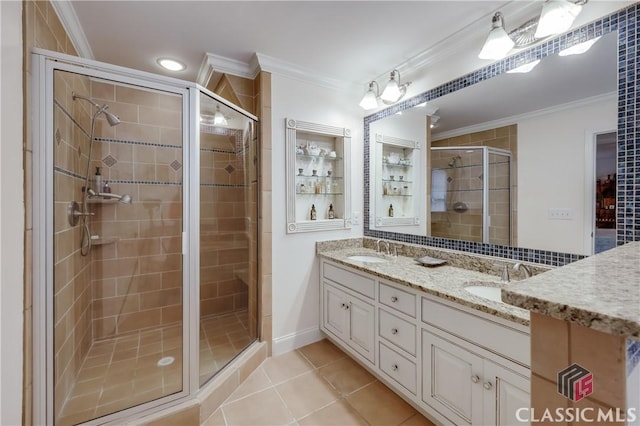 bathroom featuring ornamental molding, tile patterned flooring, and vanity