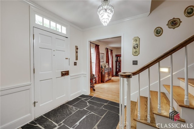 entryway featuring ornamental molding