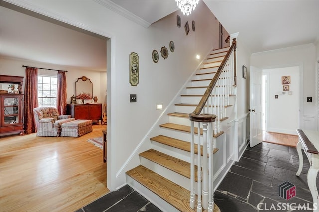 staircase featuring ornamental molding