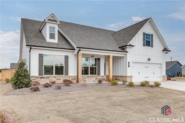 view of front of property with a garage and a porch