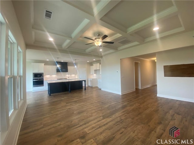 226 Montview Dr, Jefferson, GA 30549 - unfurnished living room with coffered ceiling, dark wood-type flooring, beam ceiling, baseboards, and recessed lighting