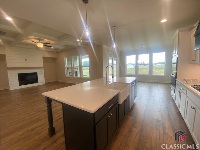 226 Montview Dr, Jefferson, GA 30549 - kitchen featuring a sink, baseboards, light countertops, dark wood-type flooring, and recessed lighting