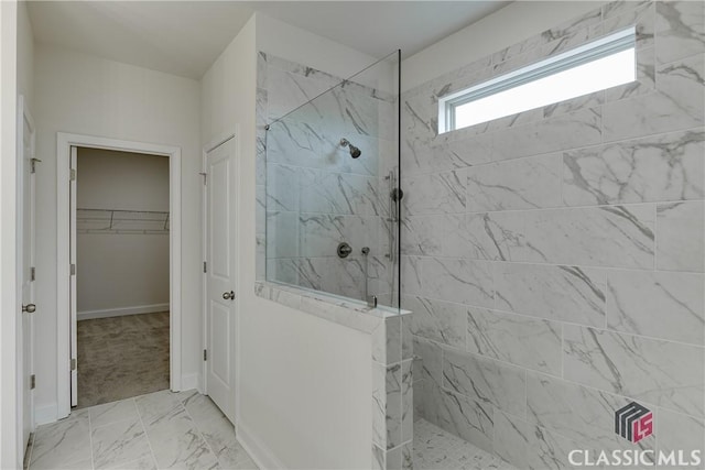 bathroom featuring a tile shower