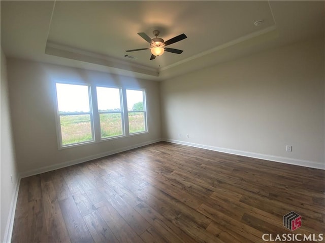 226 Montview Dr, Jefferson, GA 30549 - empty room with a raised ceiling, dark wood-style flooring, a ceiling fan, and baseboards