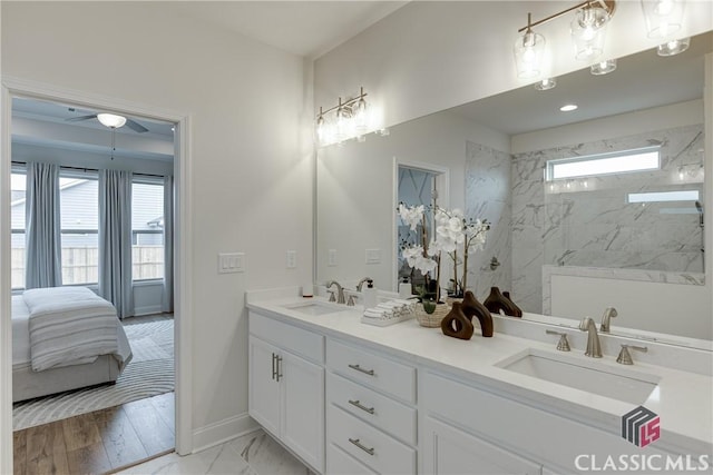 bedroom featuring baseboards, ornamental molding, wood finished floors, and a tray ceiling