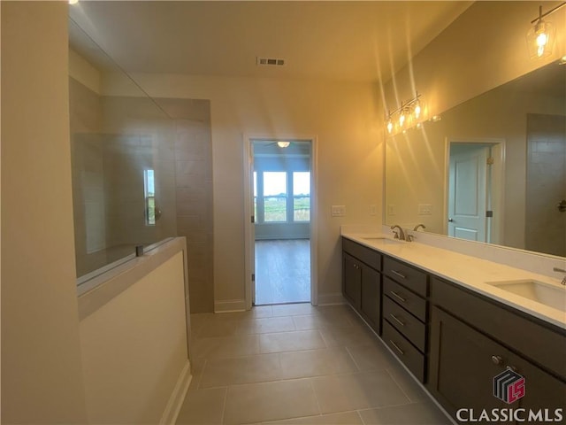 226 Montview Dr, Jefferson, GA 30549 - full bathroom featuring tile patterned flooring, double vanity, walk in shower, and baseboards