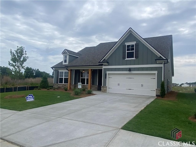 226 Montview Dr, Jefferson, GA 30549 - craftsman inspired home featuring a front lawn, concrete driveway, board and batten siding, a porch, and a shingled roof