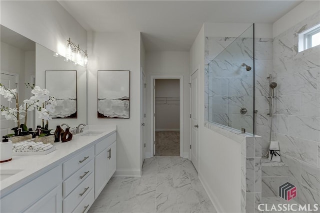 226 Montview Dr, Jefferson, GA 30549 - bathroom featuring marble finish flooring, a walk in shower, double vanity, a spacious closet, and baseboards