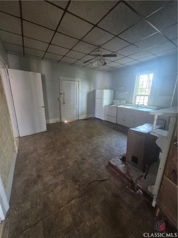 basement featuring white refrigerator