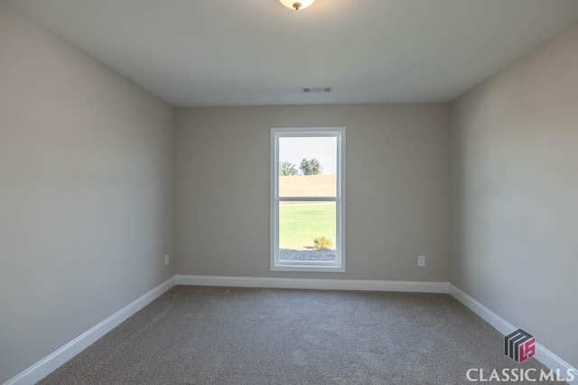 spare room featuring carpet flooring