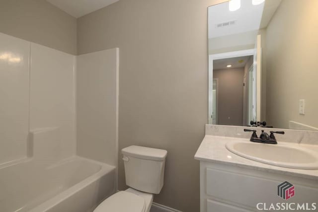 full bathroom with vanity, bathtub / shower combination, and toilet