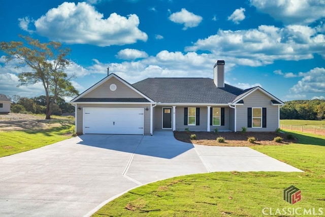 single story home featuring a garage and a front yard