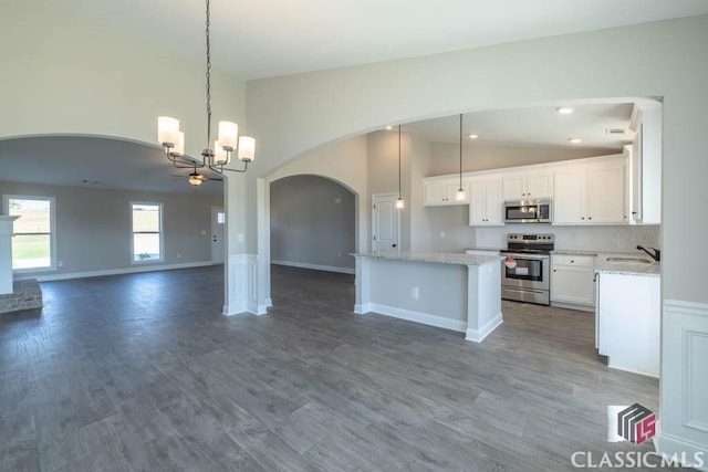 kitchen with white cabinetry, pendant lighting, and appliances with stainless steel finishes