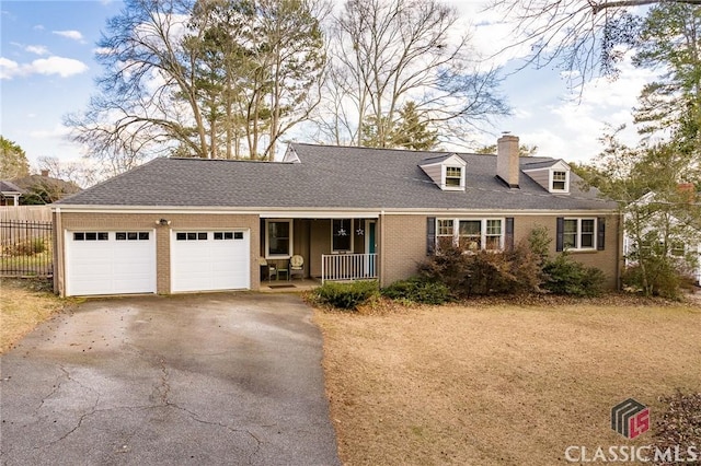 view of front of property featuring a garage and covered porch