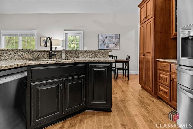 1750 Ryland Hills Dr, Watkinsville, GA 30677 - kitchen featuring stainless steel dishwasher, fridge, dark cabinets, and a healthy amount of sunlight