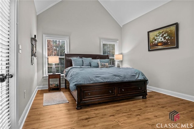 1750 Ryland Hills Dr, Watkinsville, GA 30677 - bedroom with wood finished floors, high vaulted ceiling, and baseboards