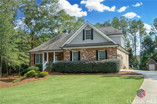 view of front of home with a garage and a front lawn