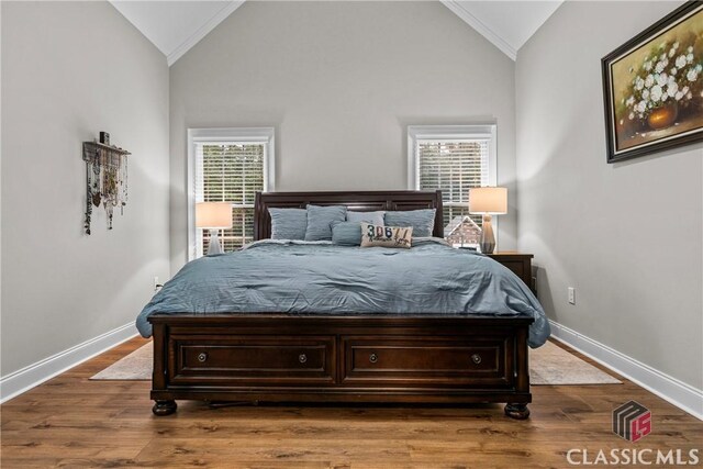 1750 Ryland Hills Dr, Watkinsville, GA 30677 - bedroom featuring baseboards, vaulted ceiling, and wood finished floors