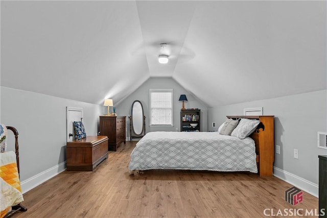 1750 Ryland Hills Dr, Watkinsville, GA 30677 - bedroom with baseboards, vaulted ceiling, a ceiling fan, visible vents, and wood finished floors