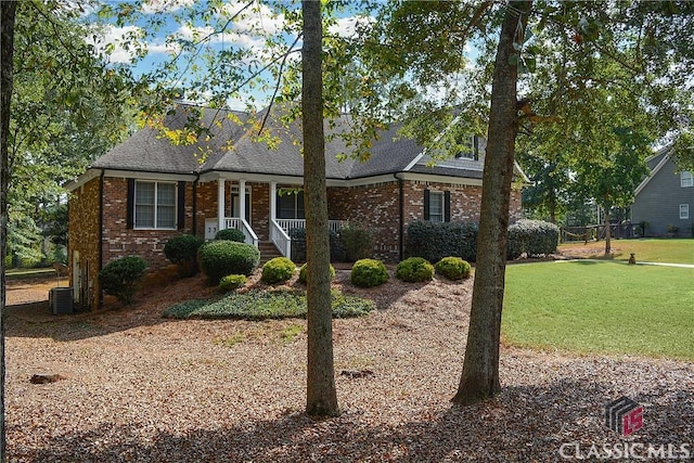 1750 Ryland Hills Dr, Watkinsville, GA 30677 - view of front of property featuring a front yard, brick siding, central AC, a shingled roof, and covered porch