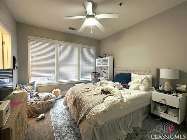 carpeted bedroom featuring ceiling fan