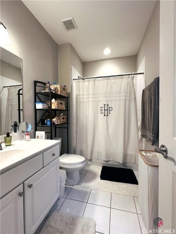 full bathroom with shower / bathtub combination with curtain, vanity, toilet, and tile patterned flooring