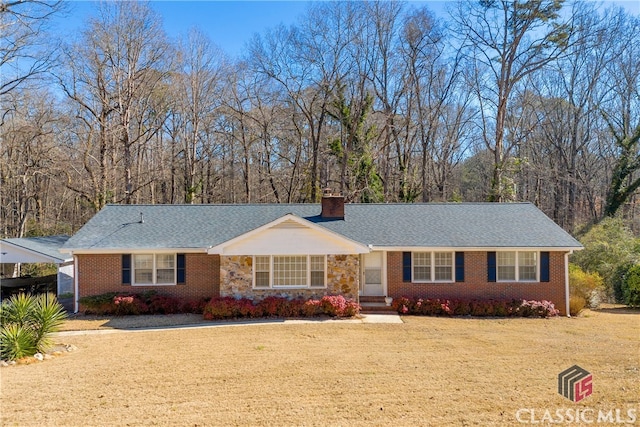 ranch-style house with a carport and a front yard