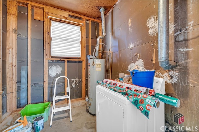 clothes washing area featuring washer / dryer and gas water heater