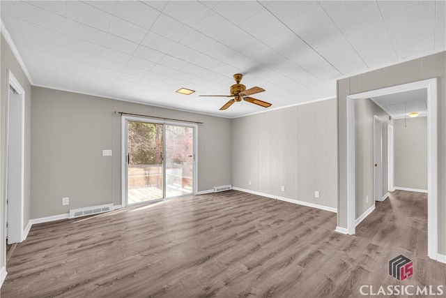 unfurnished living room with crown molding, light hardwood / wood-style flooring, and ceiling fan