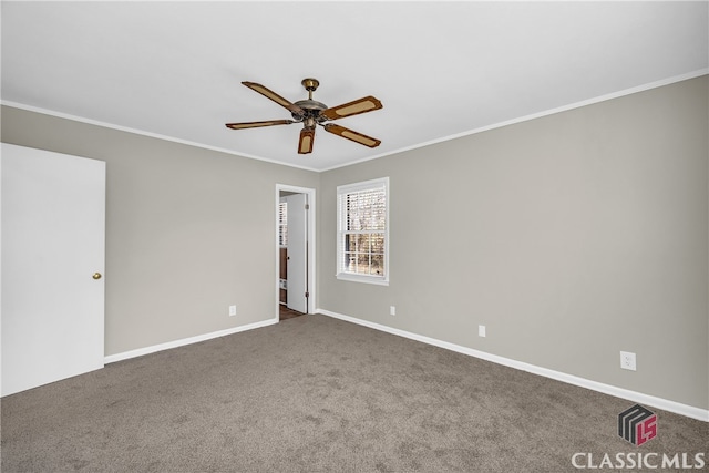 carpeted empty room with ornamental molding and ceiling fan