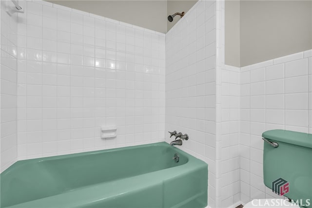 bathroom featuring toilet and shower / bathing tub combination