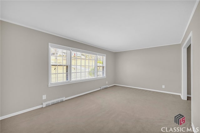 unfurnished room featuring light carpet and ornamental molding