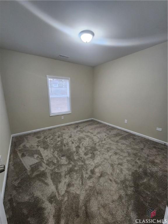 empty room featuring carpet