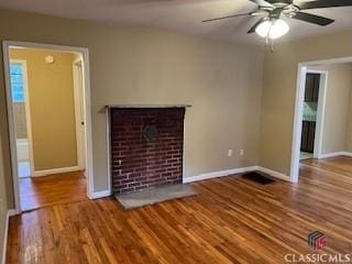 unfurnished living room with hardwood / wood-style flooring and ceiling fan