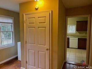 hallway with tile patterned floors