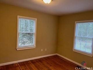 unfurnished room featuring hardwood / wood-style floors