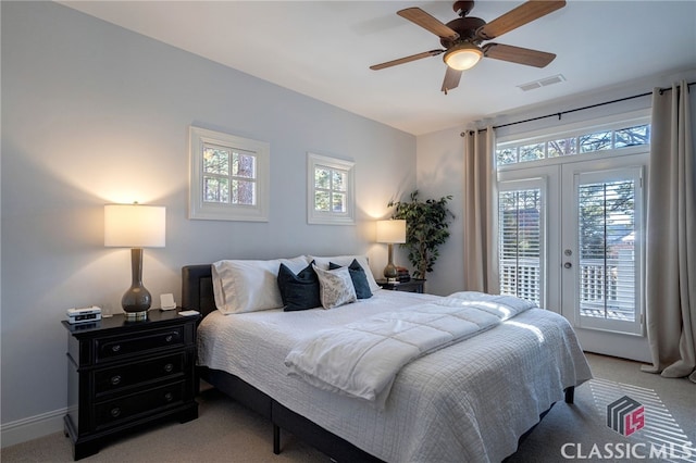 bedroom with access to outside, light colored carpet, ceiling fan, and french doors