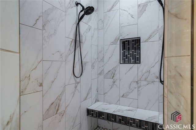 bathroom featuring a tile shower