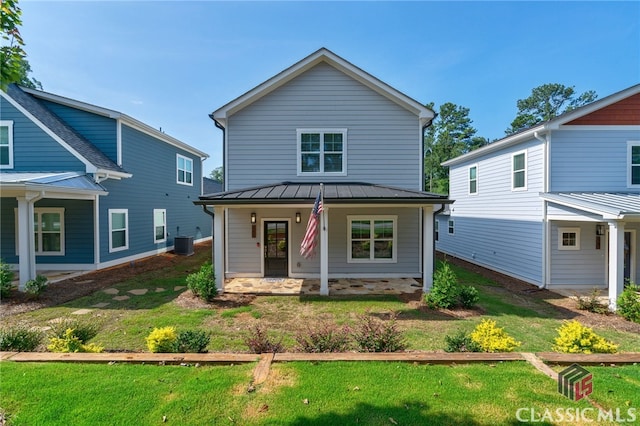 view of front of house with central AC, a front yard, and a porch