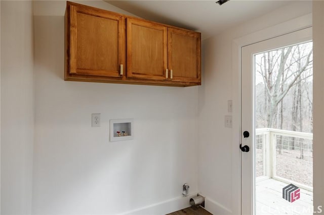 laundry room with hookup for a washing machine and cabinets