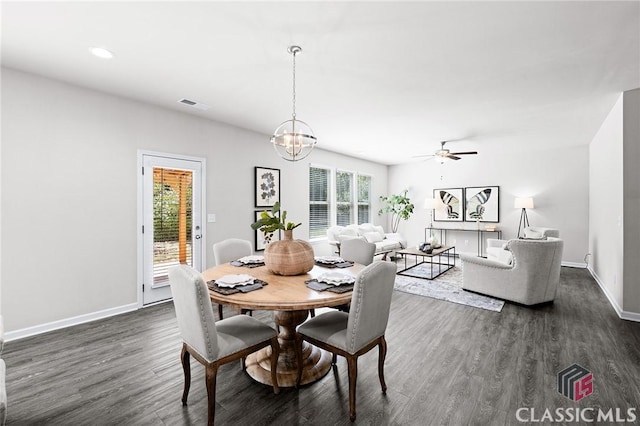 dining area featuring visible vents, ceiling fan with notable chandelier, dark wood finished floors, recessed lighting, and baseboards