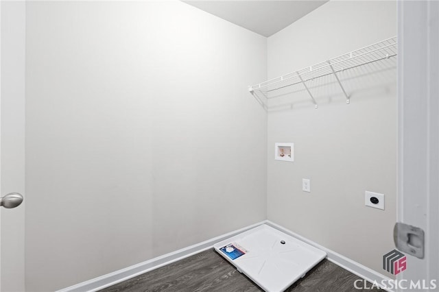 washroom with hookup for a washing machine, baseboards, hookup for an electric dryer, dark wood finished floors, and laundry area