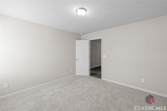 unfurnished bedroom featuring baseboards and carpet floors