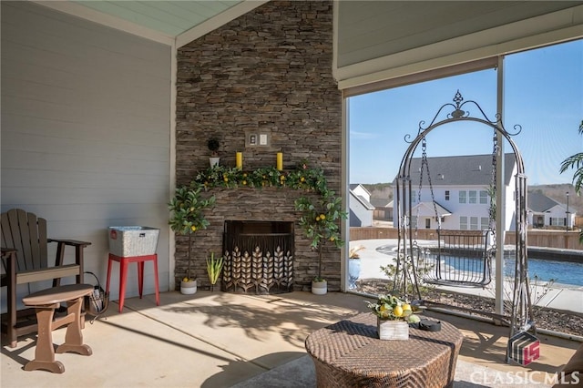 view of patio / terrace with an outdoor stone fireplace