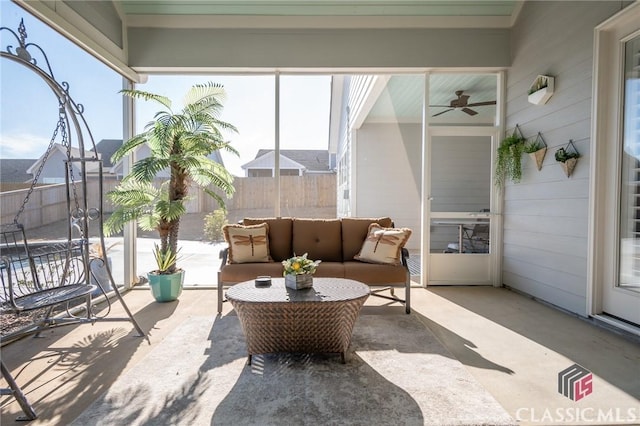 sunroom with ceiling fan