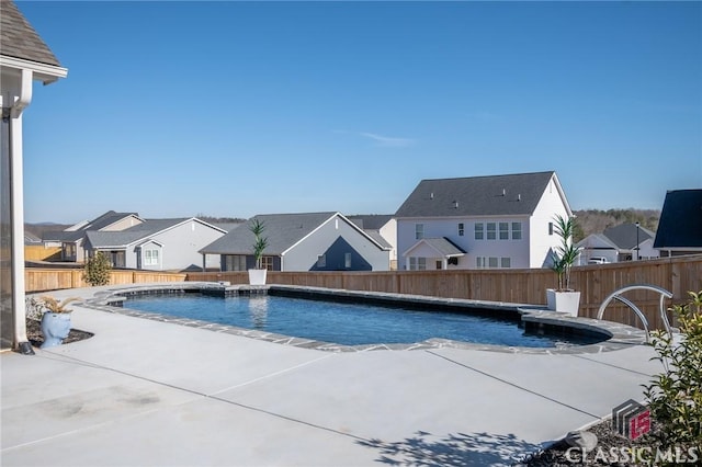 view of pool with a patio and pool water feature