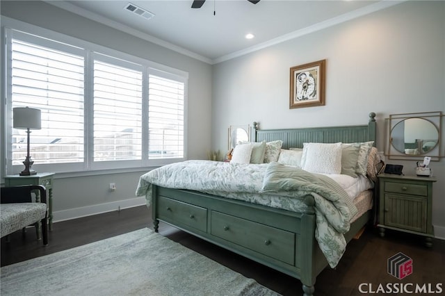 bedroom with ceiling fan, ornamental molding, and dark hardwood / wood-style floors