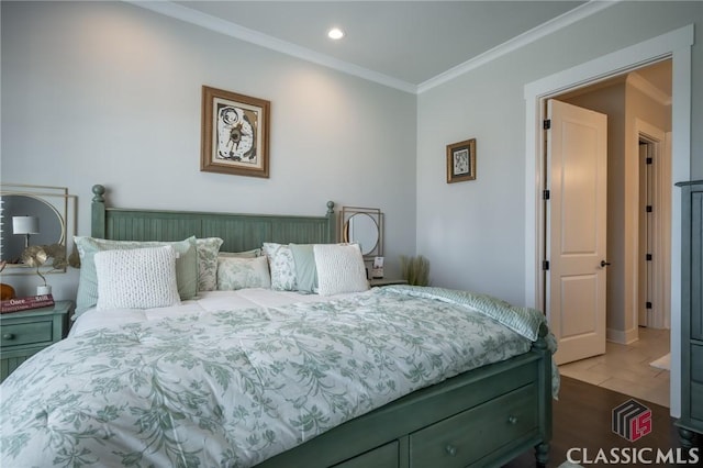 bedroom featuring crown molding and dark wood-type flooring